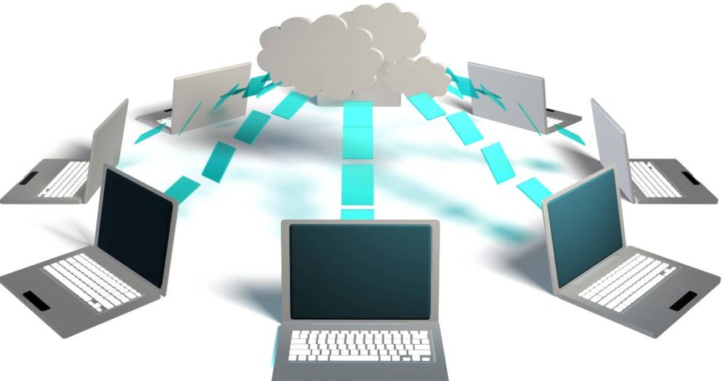 An image of computers connected to the cloud.